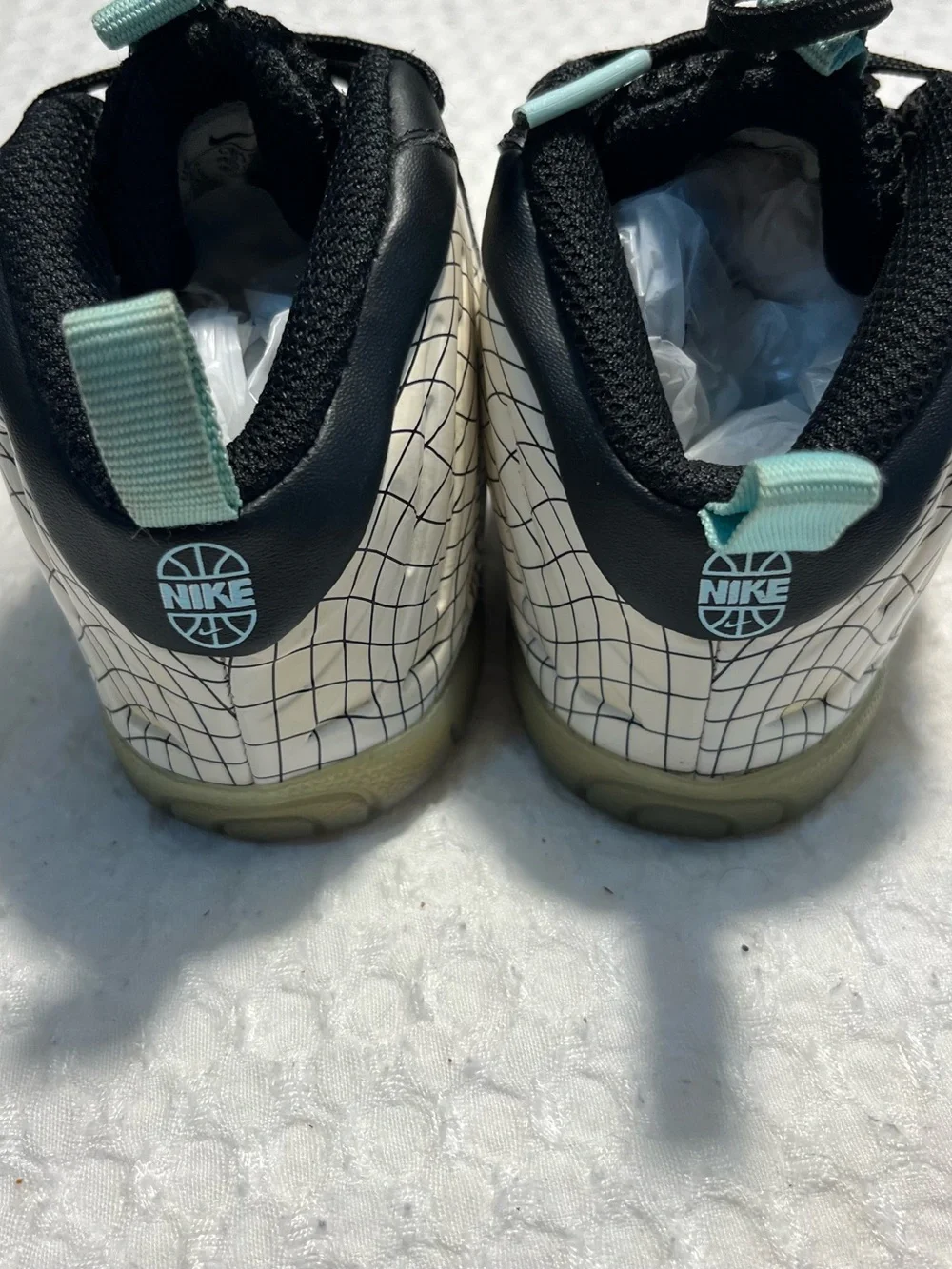 Nike Baby Black and White Grid Wrapped Sneakers with Teal Accents